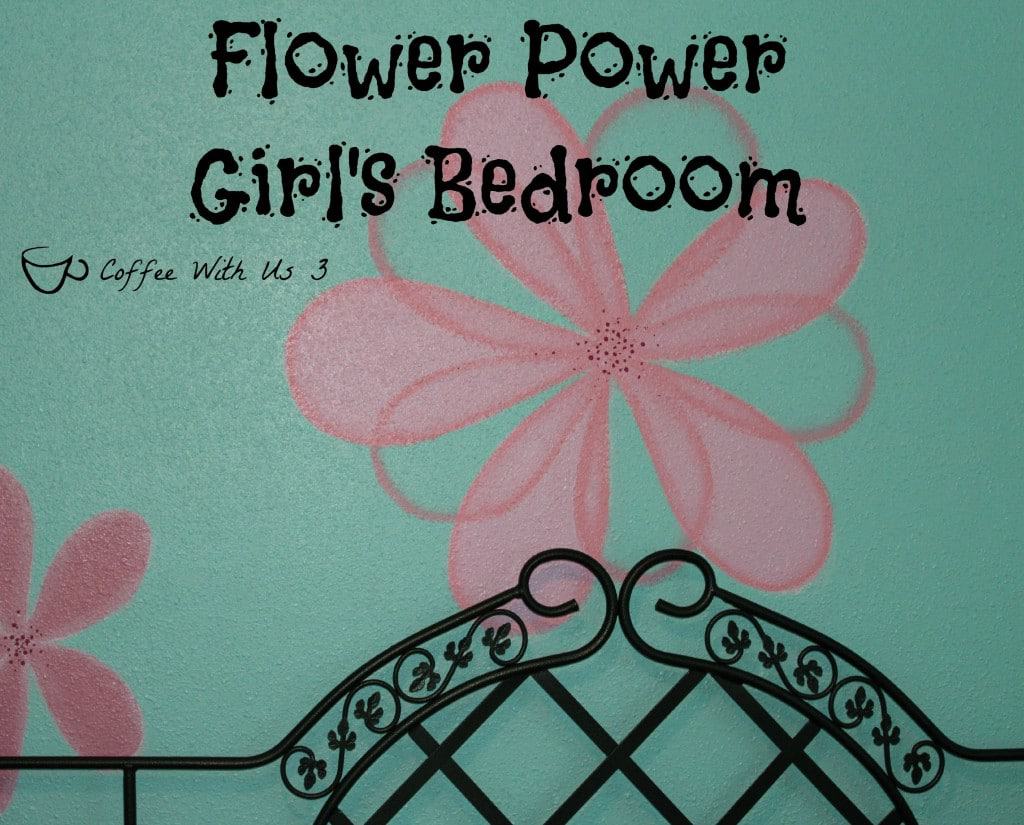 A bright wall turquoise wall color with pink flowers painted on, & some cute accessories make for a fun flower power girl's bedroom!