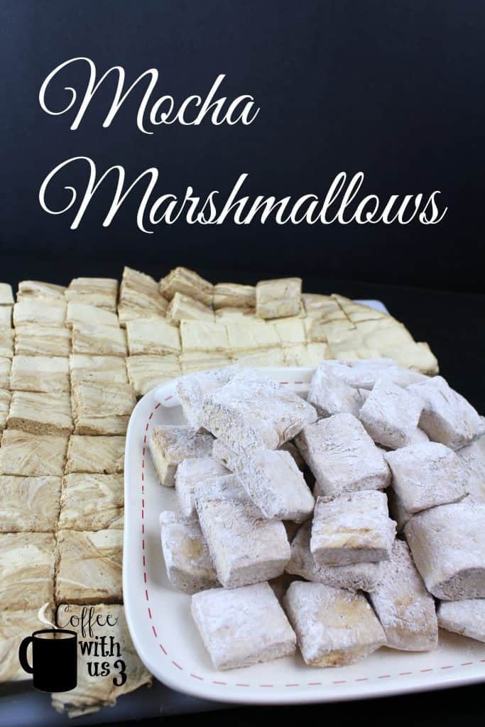 Mocha Marshmallows cut and dusted on a plate with cut undusted marshmallows in the background.