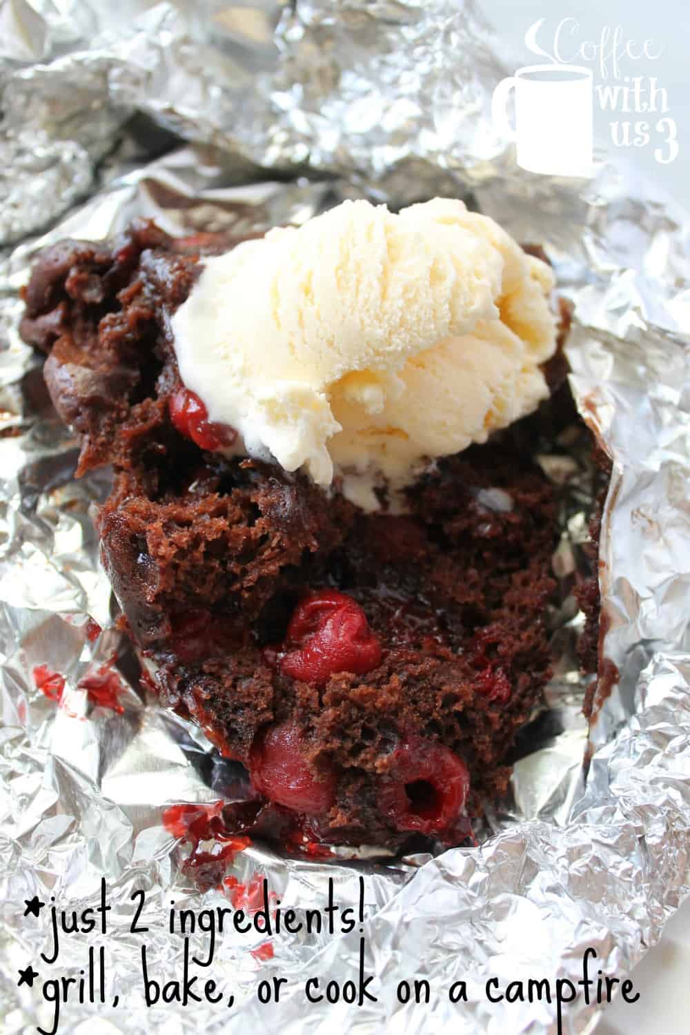 Overhead shot of red cherries in moist chocolate foil packet cake, with a scoop of vanilla ice cream on top.