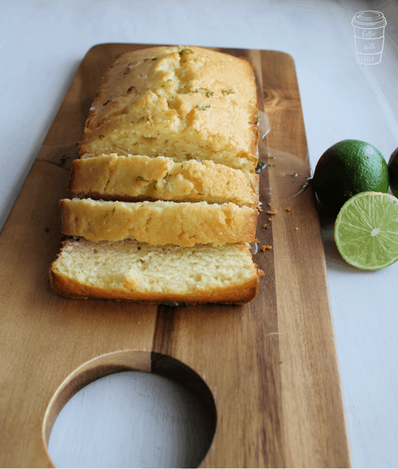 Sliced lime pound cake on a wooden cutting board